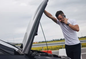 stranded driver waiting for tow truck to arrive